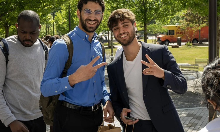 Two ECE Male Students smiling at camera