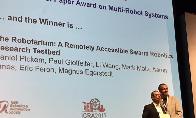 ICRA Awards Chair Martin Buss presents Best Multi-Robot Systems Paper Award to Magnus Egerstedt