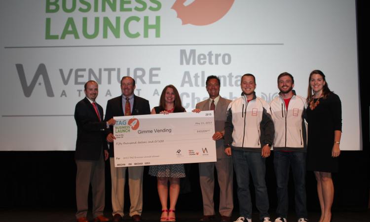 Check presentation to Gimme co-founders at the TAG Business Launch Competition.