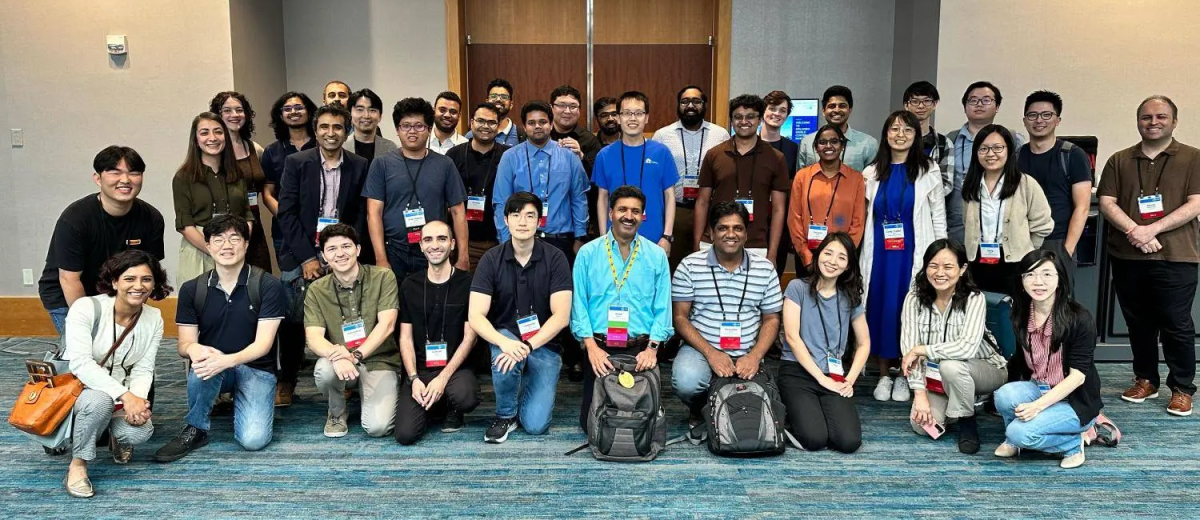 Group photo of researchers at the International Symposium on Computer Architecture.