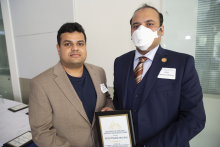 Mohit Prabhushankar, ECE Graduate Research Assistant Excellence Awards, 2022 Roger P. Webb Awards Program. Pictured with Arijit Raychowdhury, Steve W. Chaddick School Chair.